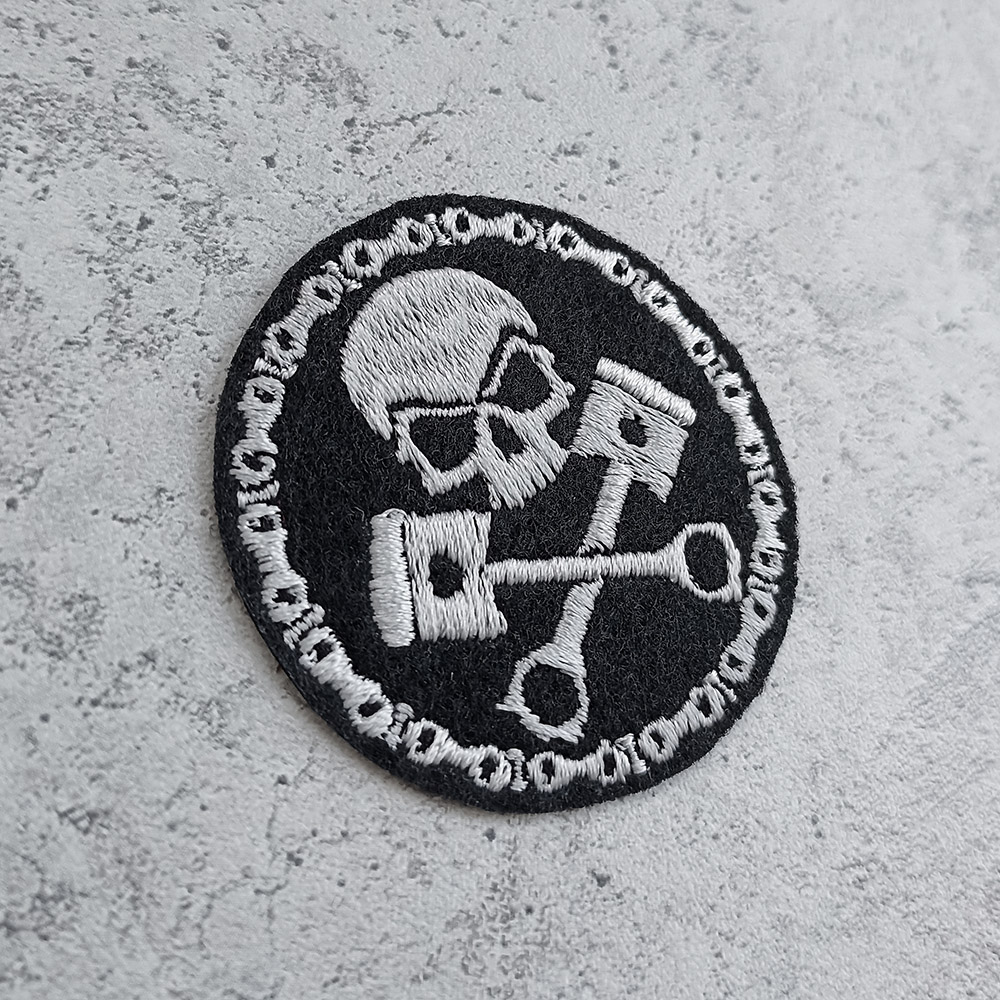 Skull with pistons and motorcycle chain patch Skull with pistons and motorcycle chain patch