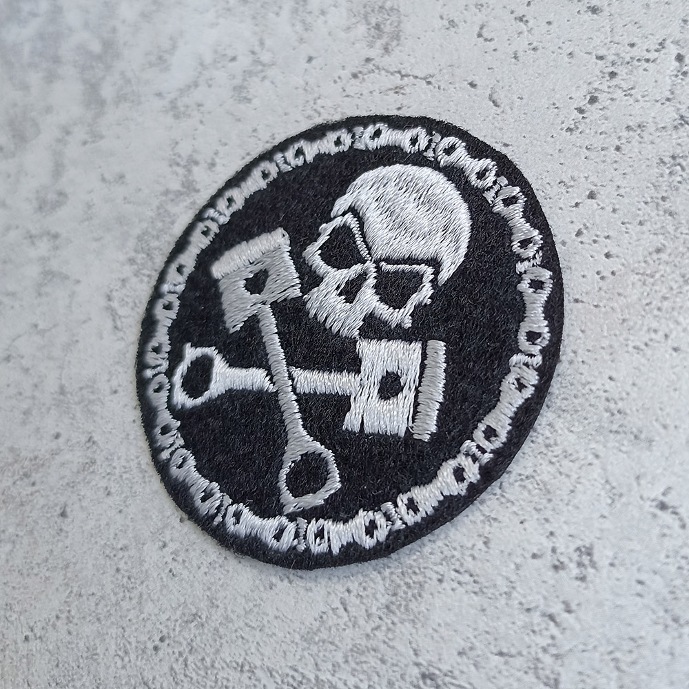 Skull with pistons and motorcycle chain patch Skull with pistons and motorcycle chain patch