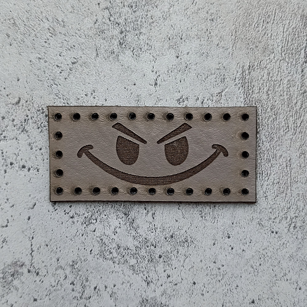 Evil smiley face leather patch Evil smiley face leather patch