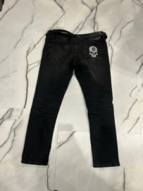 Skull patch with Yamaha logo on jeans
