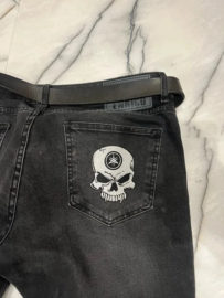 Skull patch with Yamaha logo on jeans