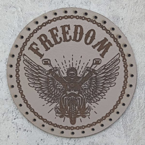 Freedom, biker on a motorcycle, wings, leather patch