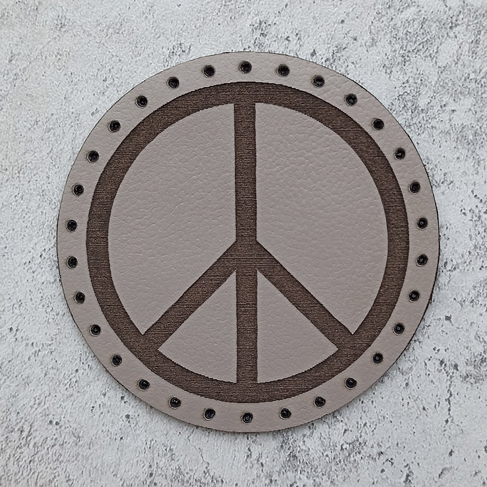 The Pacific, the international symbol of peace, leather patch The Pacific, the international symbol of peace, leather patch