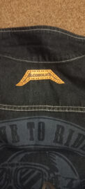 Alcoholica leather patch on a biker vest
