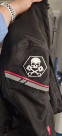 Skull with pistons patch on a motorcycle jacket