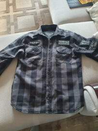Triumph patches on the motorcycle shirt