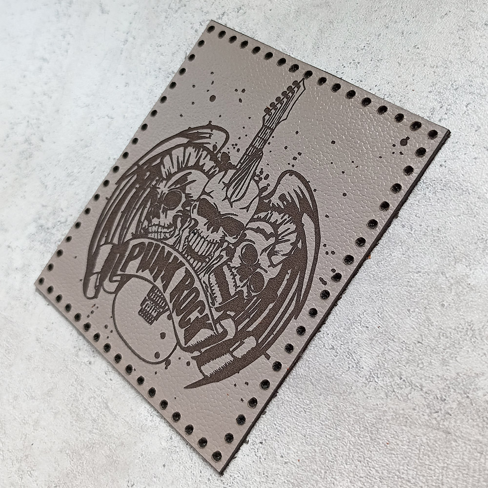 Punk Rock, three skulls with a guitar and wings, leather patch Punk Rock, three skulls with a guitar and wings, leather patch